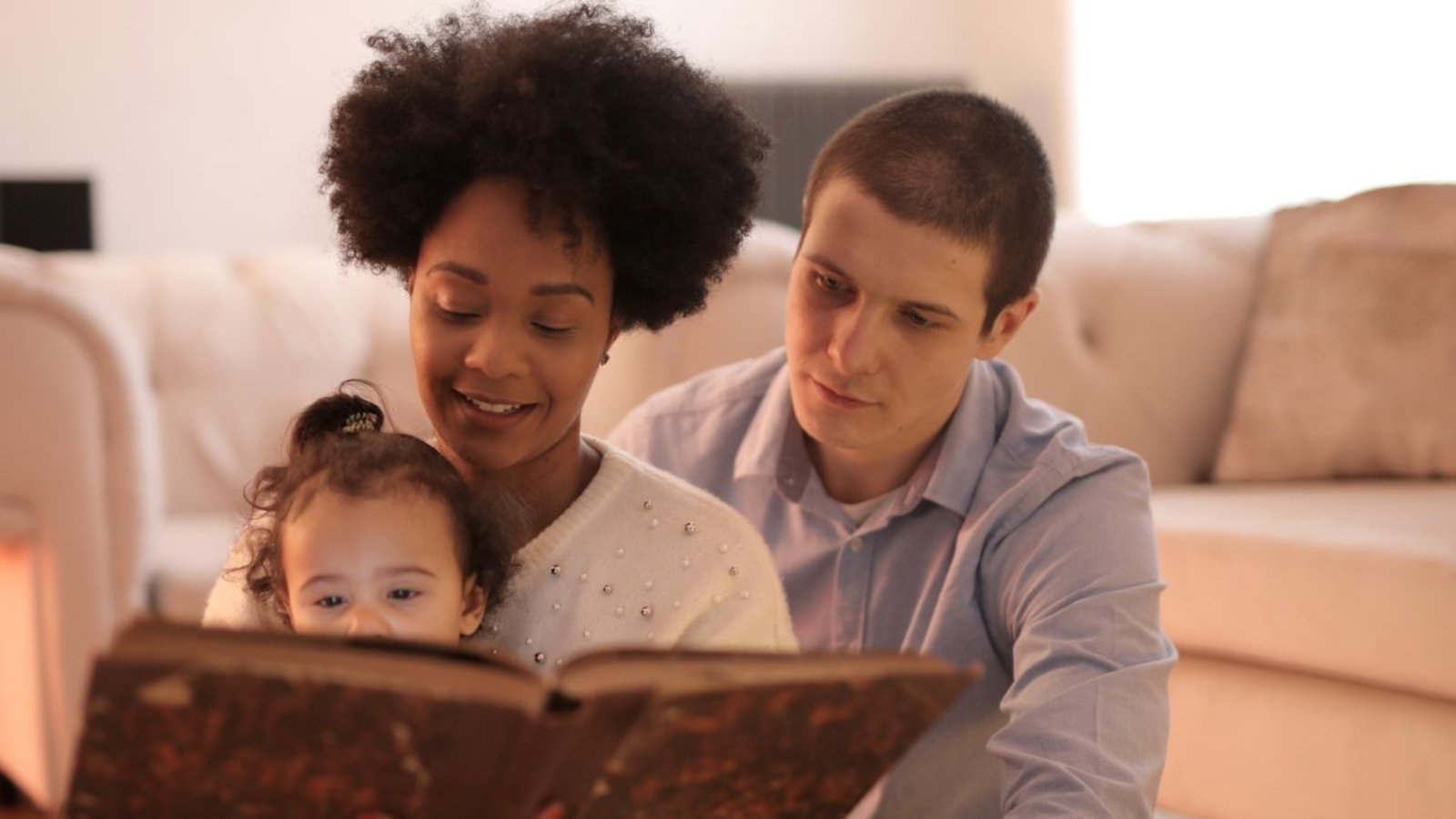 Family reading together at home as part of a daily learning routine