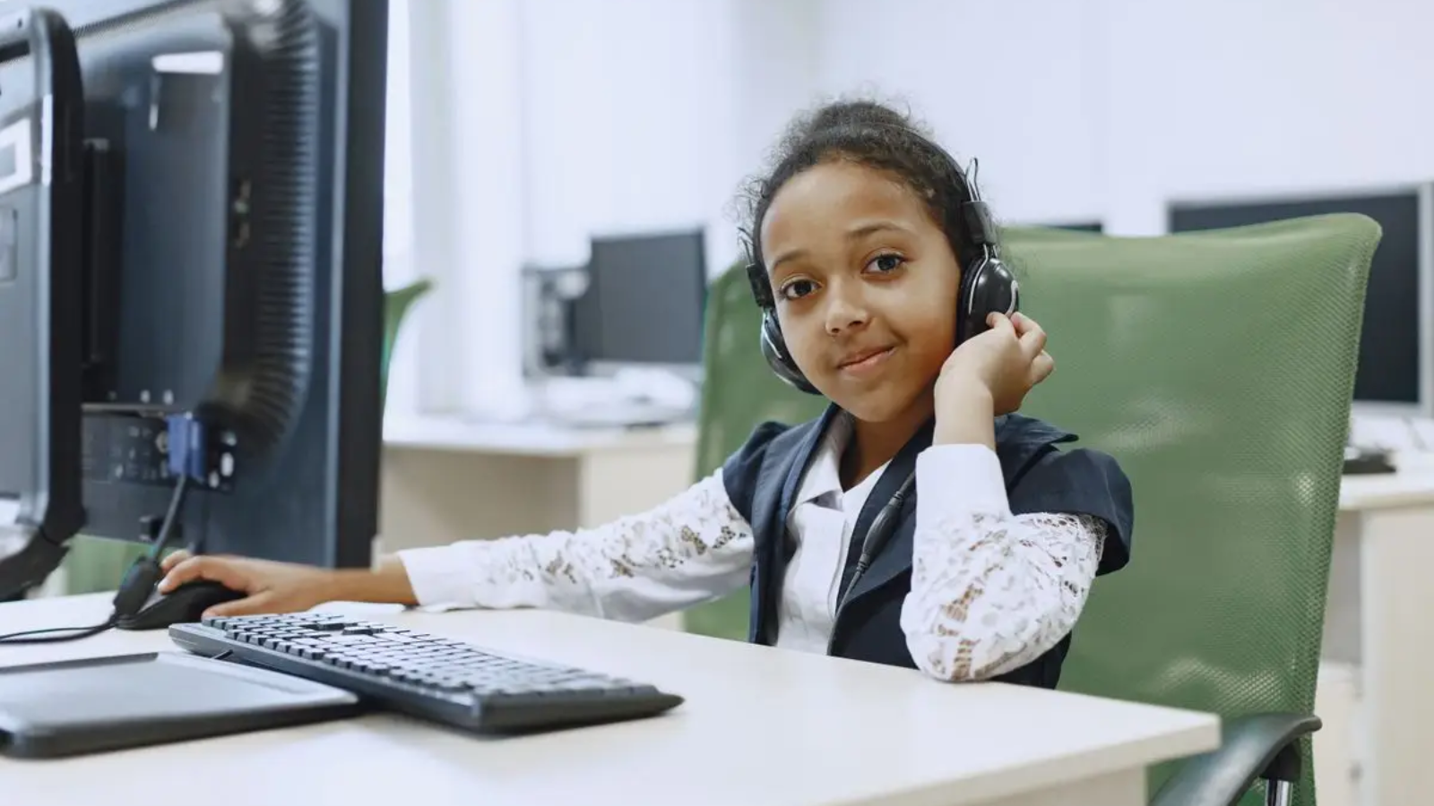 Child wearing a headset during a live online Quran class